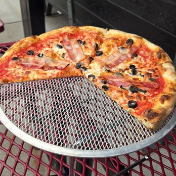 Side Project Pizza - Bacon and black olives yes as you can see I like black olives on my pizzas - Breweries Near Me - Maplewood, Missouri