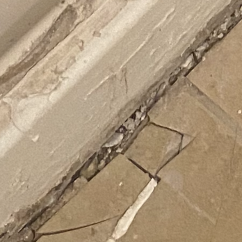 Ysa Cleaning - Tiles they broke when they tried sliding shower unit out improperly. They even said that the only way to get it out would be to saw in half. - Damage Restoration Near Me