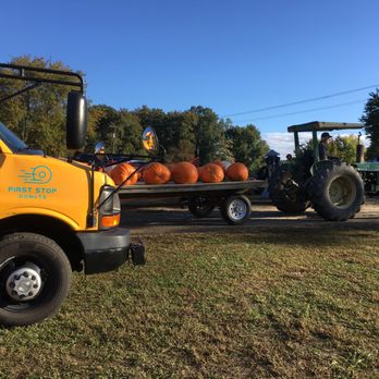 First Stop Donuts - a tractor pulling a trailer full of pumpkins - Food Trucks Near Me First Stop Donuts - a tractor pulling a trailer full of pumpkins - Food Trucks Near Me
