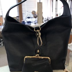 Julie's Walk In Closet - Dooney & Bourke leather bag and kiss clip pouch