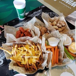 Meal for 2 with a large side of cheese fries, veggie sticks with ranch, garlic parmesan wings, lemon pepper wings, & mild buffalo wings. Meal for 2 with a large side of cheese fries, veggie sticks with ranch, garlic parmesan wings, lemon pepper wings, & mild buffalo wings.