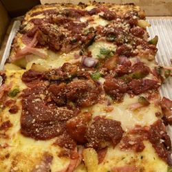 Hungry Howie's Pizza & Subs - Detroit style pizza with blobs of sauce but virtually no toppings!