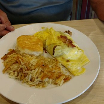 That Flippin' Egg - three large eggs,  American  cheese, bacon, pork sausage, hash browns, and a biscuit! - New American Near Me - Evans, Georgia