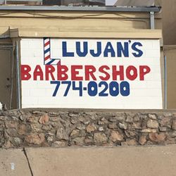 Lujan's Barber Shop - Signage behind the store.