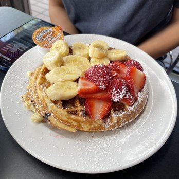 La Corte Cafe - a waffle topped with strawberries and bananas - Sandwiches Near Me - Fort Lauderdale, Florida La Corte Cafe - a waffle topped with strawberries and bananas - Sandwiches Near Me - Fort Lauderdale, Florida