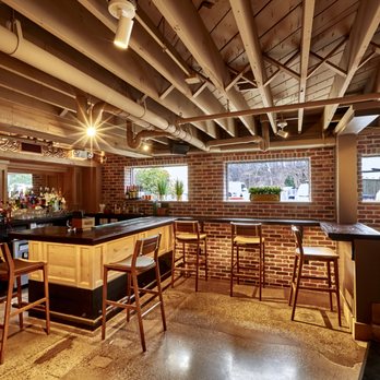 Lockheart - a brick bar with wooden bar stools - Mexican Near Me - Wellesley, Massachusetts Lockheart - a brick bar with wooden bar stools - Mexican Near Me - Wellesley, Massachusetts