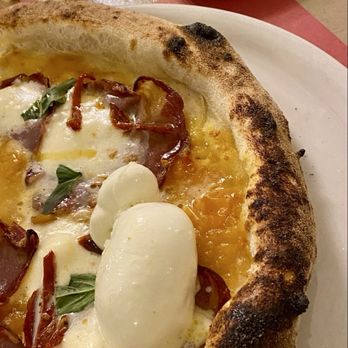 Schiticchio - Partial pic of pizza with yellow tomato and burrata because we devoured before I could photo- grilled vegetables in the background - Pizza Near Me - Siracusa, SR
