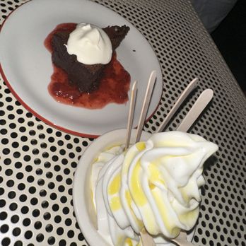 Birdie's - Flourless chocolate cake with strawberry jam and creme fraiche $14; Heilala vanilla soft serve with blood orange Agrumato $12 - French Near Me - Austin, Texas Birdie's - Flourless chocolate cake with strawberry jam and creme fraiche $14; Heilala vanilla soft serve with blood orange Agrumato $12 - French Near Me - Austin, Texas