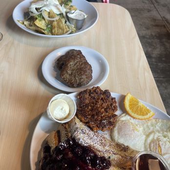 Two Chicks - Chilaquiles verde (farther plate) Poppyseed French Toast Combo (w/ Chorizo & Eggs) - Breakfast & Brunch Near Me - Reno, Nevada Two Chicks - Chilaquiles verde (farther plate) Poppyseed French Toast Combo (w/ Chorizo & Eggs) - Breakfast & Brunch Near Me - Reno, Nevada