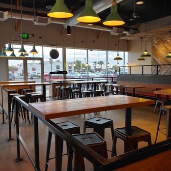 MOD Pizza - tables and stools in a restaurant - Fast Food Near Me - Glendale, Arizona