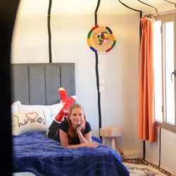 Journeys & Zen Morocco - A bedroom view from the private bathroom at Arawan Luxury Desert Camp--comfortable beds, thoughtful design and Sahara style in Erg Lihoudi.