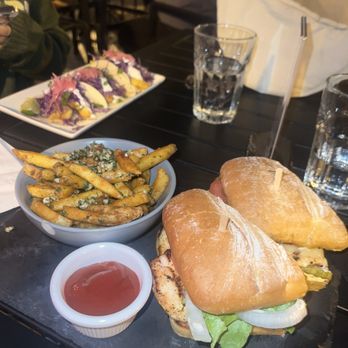 Purgatory Whiskey Bar & Craft Beer - Grilled chicken Sandwich with garlic fries and Fried Chicken Tacos - Whiskey Bars Near Me - Tracy, California
