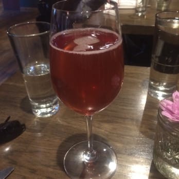 Swift's Attic - Pomegranate Mimosa - New American Near Me - Austin, Texas