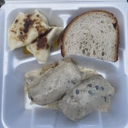 Potato and cheese pierogi, rye bread, and golumpki with mushroom sauce.