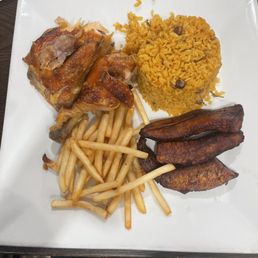 Baked Chicken with yellow rice, French fries, and sweet plantains Baked Chicken with yellow rice, French fries, and sweet plantains