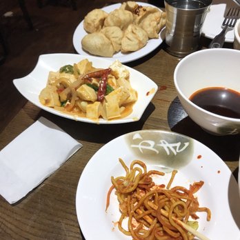 Phayul - Fried chicken momos in the back and in the middle some deliciously spicy tofu - Himalayan/Nepalese Near Me - Jackson Heights, New York Phayul - Fried chicken momos in the back and in the middle some deliciously spicy tofu - Himalayan/Nepalese Near Me - Jackson Heights, New York