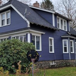 Peguero Construction - Indigo blue vinyl siding