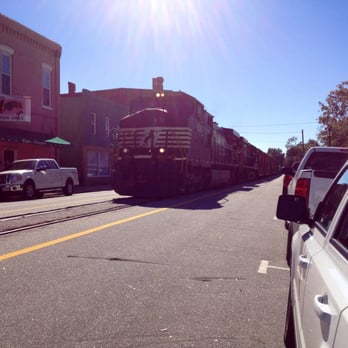 Hildebrandt's - Freight train comes down street in front of store at 11:15AM. Unique event adds to pleasure of eating here. - Delis Near Me - Augusta, Georgia