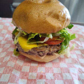 Kottu King - Beef Burger - Big juicy pattie centered between lightly roasted soft buns accompanied with cheese, lettuce, pickles and or jalapeno pickle - Food Trucks Near Me - Airdrie, Alberta Kottu King - Beef Burger - Big juicy pattie centered between lightly roasted soft buns accompanied with cheese, lettuce, pickles and or jalapeno pickle - Food Trucks Near Me - Airdrie, Alberta