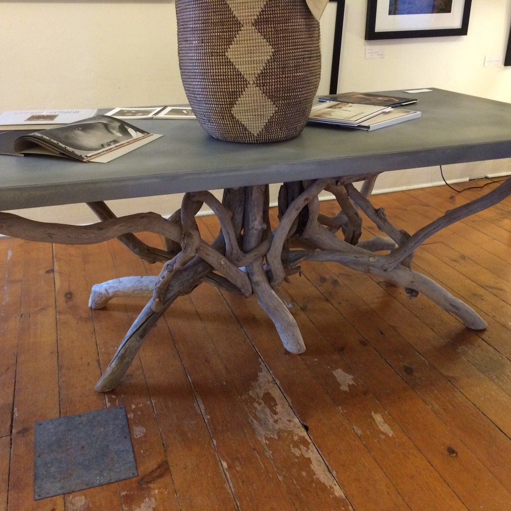 Driftwood base with a floating translucent table top. Love the metal patch on the floor. Driftwood base with a floating translucent table top. Love the metal patch on the floor.