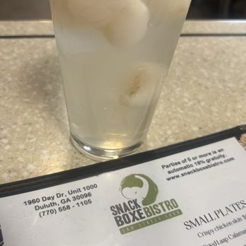 Snackboxe Bistro - Lychee nectar w/ lychee fruit so delicious and refreshing - Laotian Near Me - Duluth, Georgia