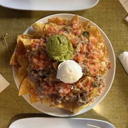 The Local - Kulua pork nachos with shredded cheese instead of queso.