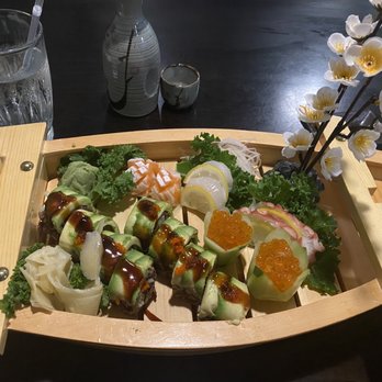 Salmon Sushi - Dragon Roll with brown rice, sashimi octopus, Scallop and the freshest Ikura. - Japanese Near Me - Staten Island, New York Salmon Sushi - Dragon Roll with brown rice, sashimi octopus, Scallop and the freshest Ikura. - Japanese Near Me - Staten Island, New York