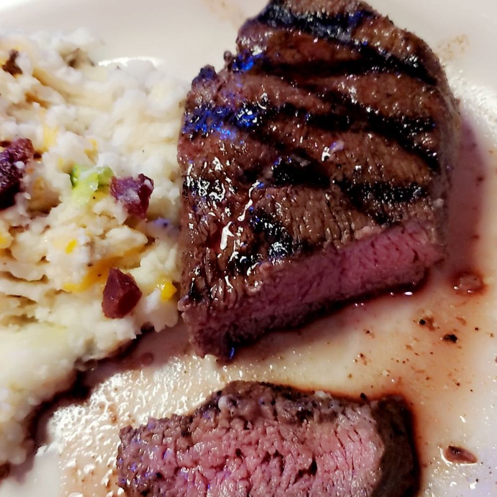 Perfectly cooked steak and loaded mashed potatoes! Perfectly cooked steak and loaded mashed potatoes!