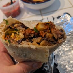 Pork burrito, black beans, grilled veggies, all the fixings. Pork burrito, black beans, grilled veggies, all the fixings.