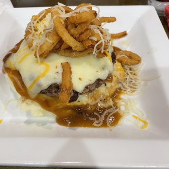 HV's Food & Spirits - Rat Rod (burger patty, cheese, onion strings) on top of mashed potatoes and gravy. - American Near Me - Olney, Illinois HV's Food & Spirits - Rat Rod (burger patty, cheese, onion strings) on top of mashed potatoes and gravy. - American Near Me - Olney, Illinois