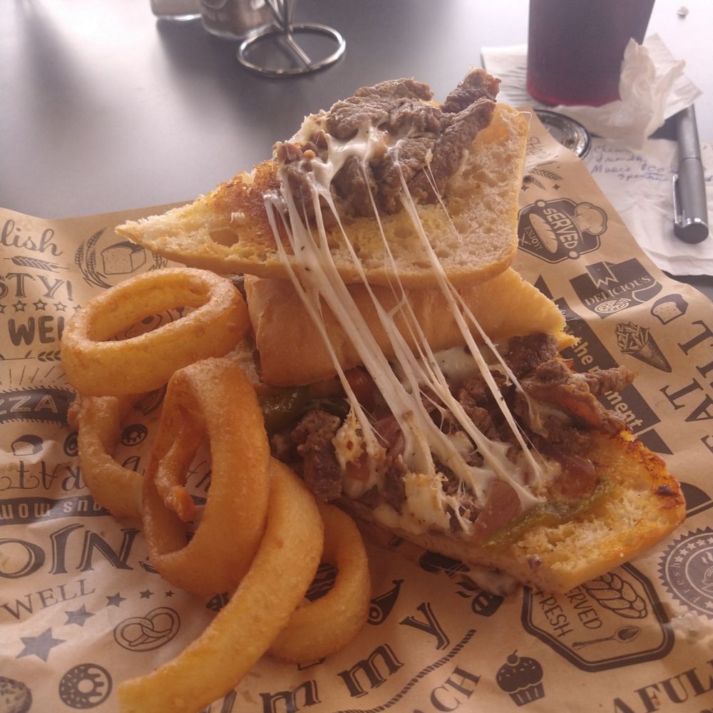 Maggy's House - Open steak sandwich and onions rings on plate. - American Near Me - Lehigh Acres, Florida Maggy's House - Open steak sandwich and onions rings on plate. - American Near Me - Lehigh Acres, Florida