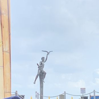Baywatch Dolphin Tours - Statue on the pier as you enter the boat. - Tours Near Me - Galveston, Texas
