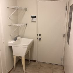 Ohana Navy Family Housing - Laundry room, leading to garage. Love the mud sink!