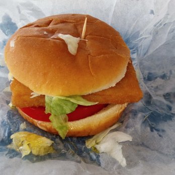 Powell's Dairy Freeze - Fish sandwich. It's a flat square patty. Veg is fresh w/ a thick tomato slice. Wet under it is grease from the patty, not water from veg. - Ice Cream & Frozen Yogurt Near Me - Starke, Florida Powell's Dairy Freeze - Fish sandwich. It's a flat square patty. Veg is fresh w/ a thick tomato slice. Wet under it is grease from the patty, not water from veg. - Ice Cream & Frozen Yogurt Near Me - Starke, Florida