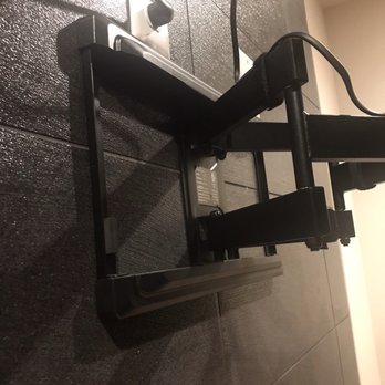 R&N Technical - TV Mounted (full motion mount) above Fireplace by Raymond - Security Systems Near Me - Colorado Springs, Colorado