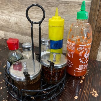Jiu Fu Cafe 明记 - They kept condiments from previous owner. These glass containers are 花椒油 pepper oil and 辣椒油 toasted pepper oil. - Chinese Near Me - Houston, Texas Jiu Fu Cafe 明记 - They kept condiments from previous owner. These glass containers are 花椒油 pepper oil and 辣椒油 toasted pepper oil. - Chinese Near Me - Houston, Texas