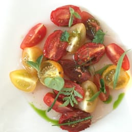 Tomatoes from the garden with rose and bergamot