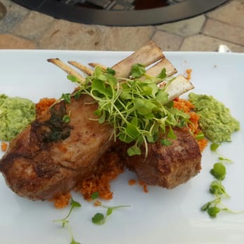 Vin 25 - Rack of lamb perfectly cooked medium rare. Pesto sauce was yummy. - New American Near Me - Roswell, Georgia