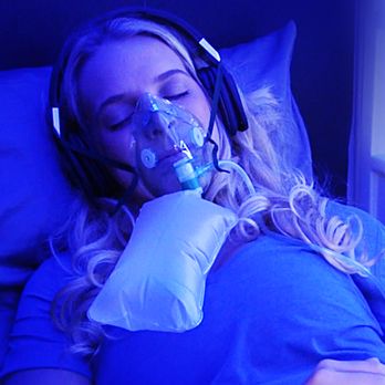 PERFORMANCE powered by EVO - A patient relaxes in the Infusio PERFORMANCE® Hyperbaric Oxygen Chamber - Sports Medicine Near Me - Beverly Hills, California PERFORMANCE powered by EVO - A patient relaxes in the Infusio PERFORMANCE® Hyperbaric Oxygen Chamber - Sports Medicine Near Me - Beverly Hills, California