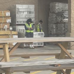 Lowe's Home Improvement - Loading a lot of materials and this guys on their phones