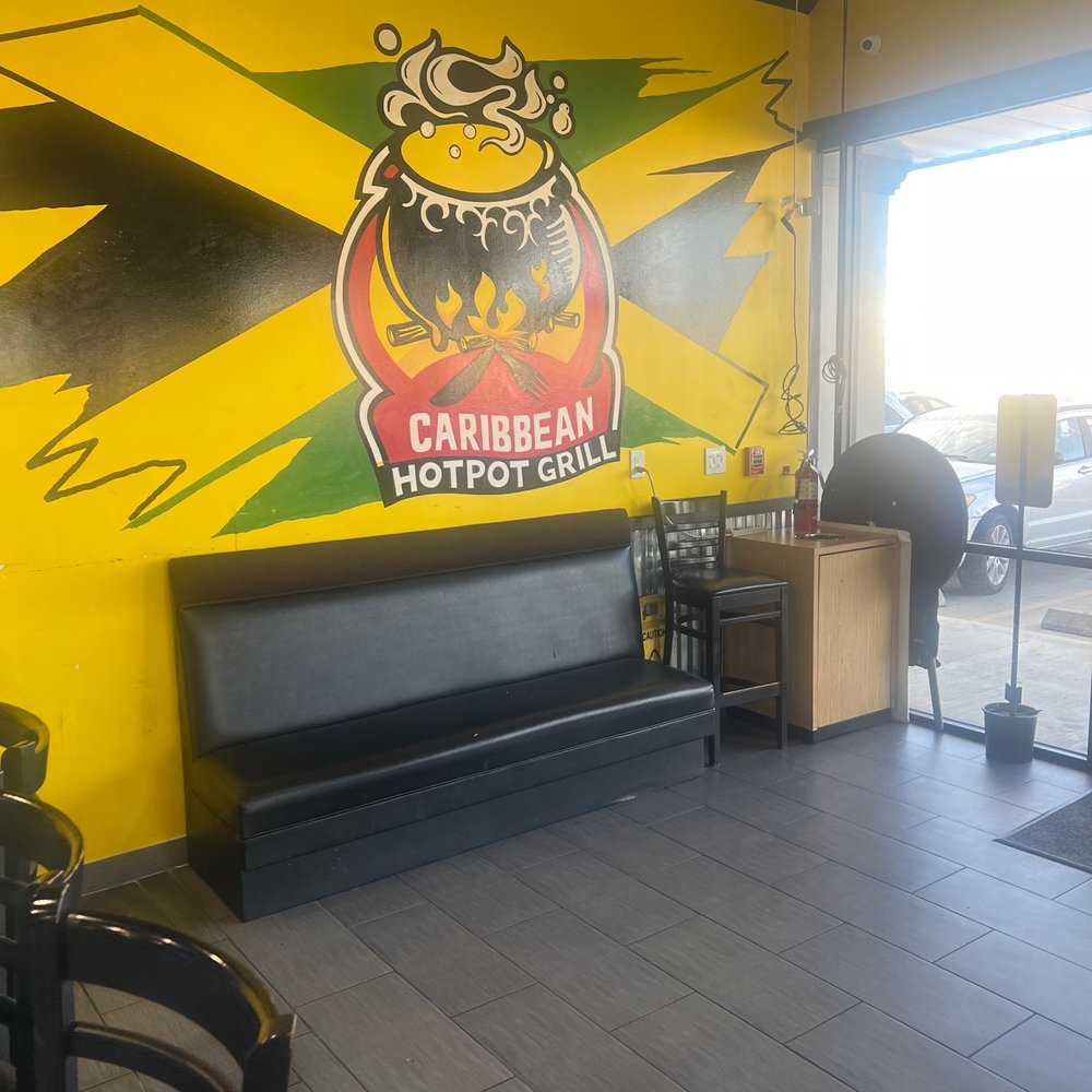 Caribbean Hotpot Grill - Painting on wall by the door - Caribbean Near Me - Houston, Texas Caribbean Hotpot Grill - Painting on wall by the door - Caribbean Near Me - Houston, Texas