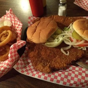 Still Four Corners - Our famous hand breaded 8 or 14 ounce tenderloin. - Sports Bars Near Me - Hopkinton, Iowa Still Four Corners - Our famous hand breaded 8 or 14 ounce tenderloin. - Sports Bars Near Me - Hopkinton, Iowa