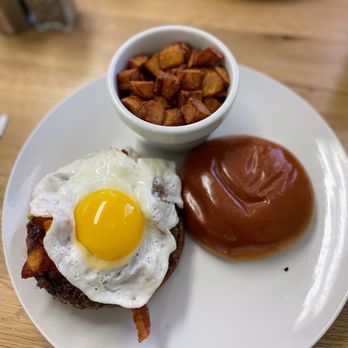 Ocean View Restaurant - a plate of food including a fried egg, hash browns, and a cup of ketchup - Breakfast & Brunch Near Me - Kure Beach, North Carolina