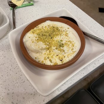 Tabla Indian Restaurant Winter Park - Rasmalai, a dessert of paneer cheese in a cardamom sauce and topped with crushed pistachio. - Chinese Near Me - Winter Park, Florida Tabla Indian Restaurant Winter Park - Rasmalai, a dessert of paneer cheese in a cardamom sauce and topped with crushed pistachio. - Chinese Near Me - Winter Park, Florida