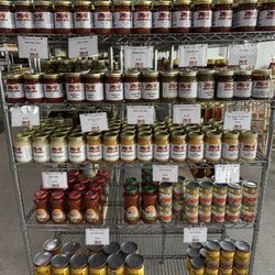 Southside Produce Market - Shelves of jarred and canned products including many with their own label.