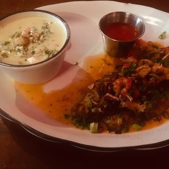 Moonshine Grill - Crawfish atop of catfish--don't forget to get your rolls. - Southern Near Me - Austin, Texas