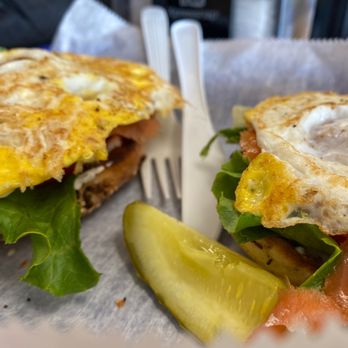 Bagelicious Deli & Bakery - My open face bagel... whole wheat EVERYTHING... with one fried egg on each side, lettuce, tomato, onion, LOX .. and a pickle - Bagels Near Me - Ocala, Florida Bagelicious Deli & Bakery - My open face bagel... whole wheat EVERYTHING... with one fried egg on each side, lettuce, tomato, onion, LOX .. and a pickle - Bagels Near Me - Ocala, Florida