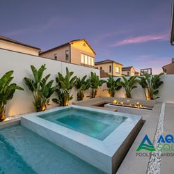 Aqua Squad Pools & Landscaping - Custom modern pool and spa with built-in fire feature, designed for Arizona outdoor living and low-maintenance luxury.