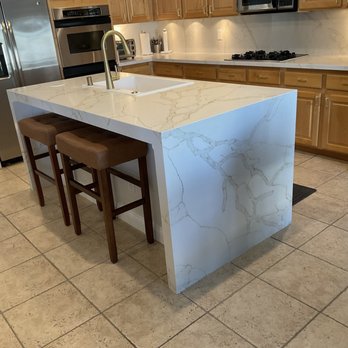 Carrillo Innovations - Waterfall Quartz Island, Quartz countertops and Quartz backsplash in kitchen. - Countertop Installation Near Me - Las Vegas, Nevada