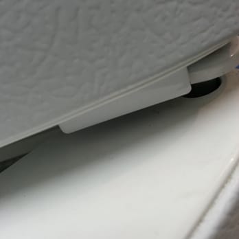 Black Belt Movers - You can't tell from this picture but a washer is missing on the refrigerator door pivot.  Yes they took it apart to move it. - Movers Near Me